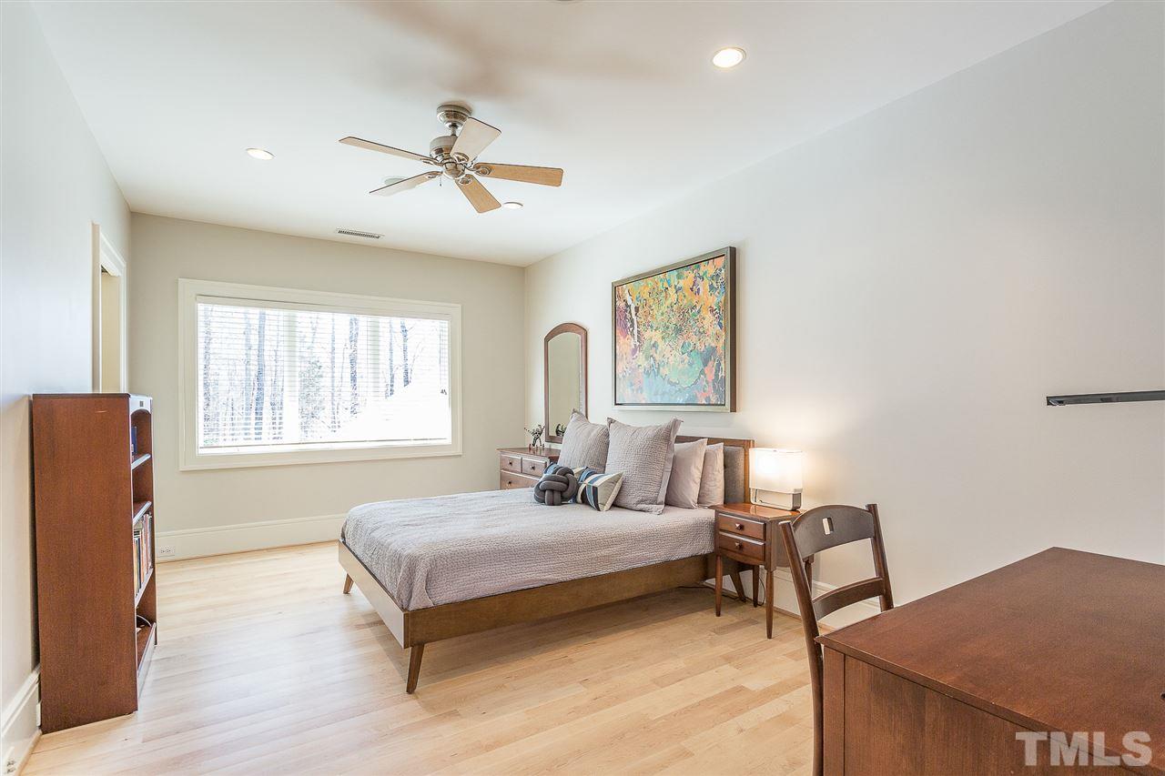 1117 Baslow Brook Court Raleigh, NC 27614 - Photo 21 of 30 a bedroom with a bed and a table
