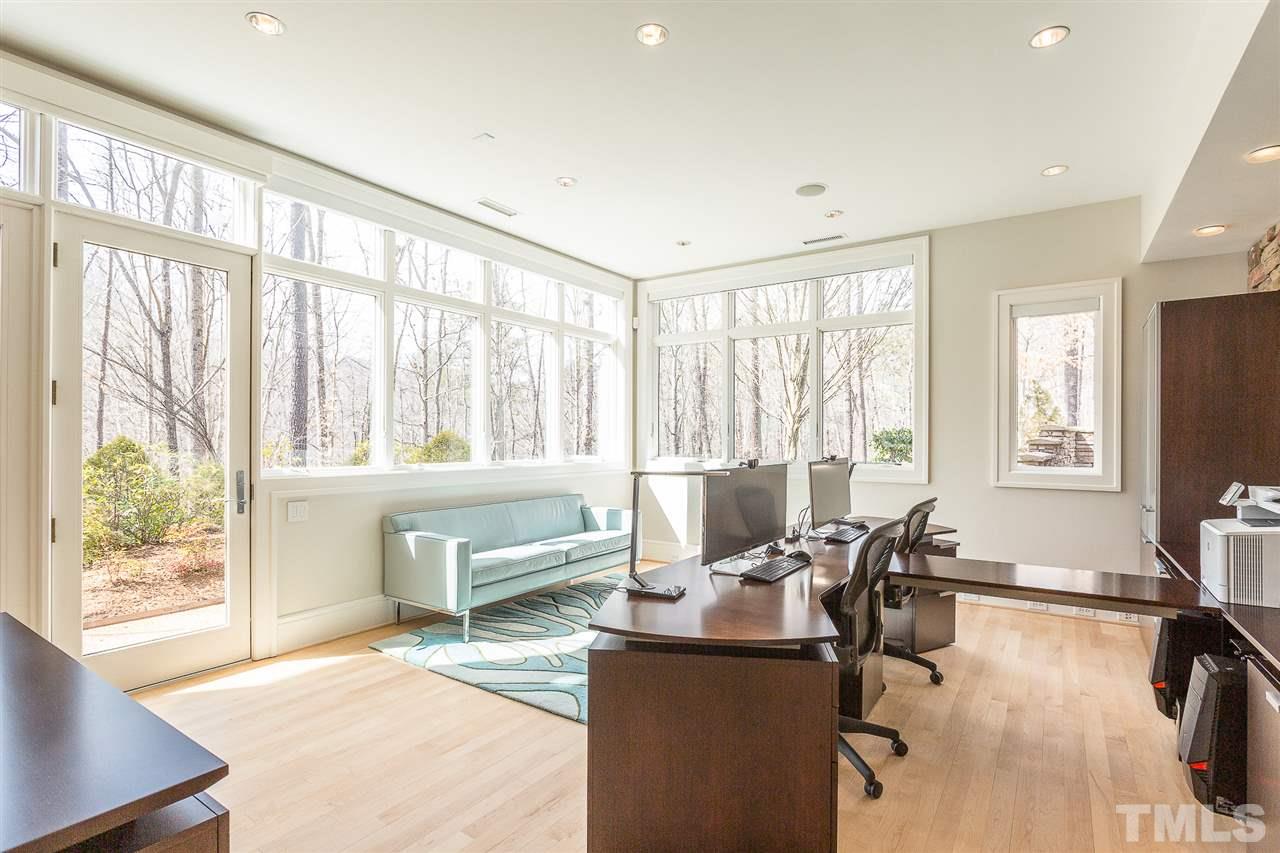1117 Baslow Brook Court Raleigh, NC 27614 - Photo 26 of 30 a living room with furniture and floor to ceiling windows