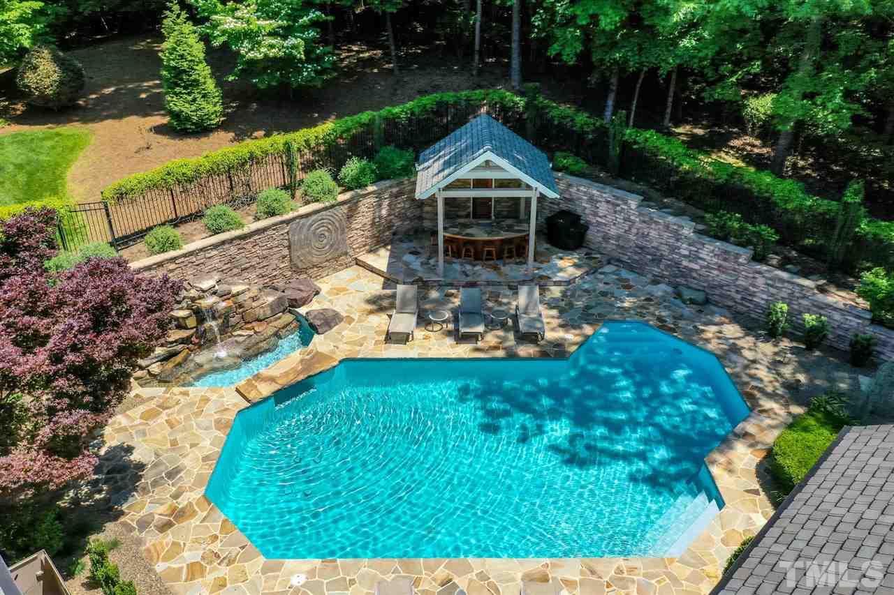 1117 Baslow Brook Court Raleigh, NC 27614 - Photo 6 of 30 a backyard of a house with lots of green space