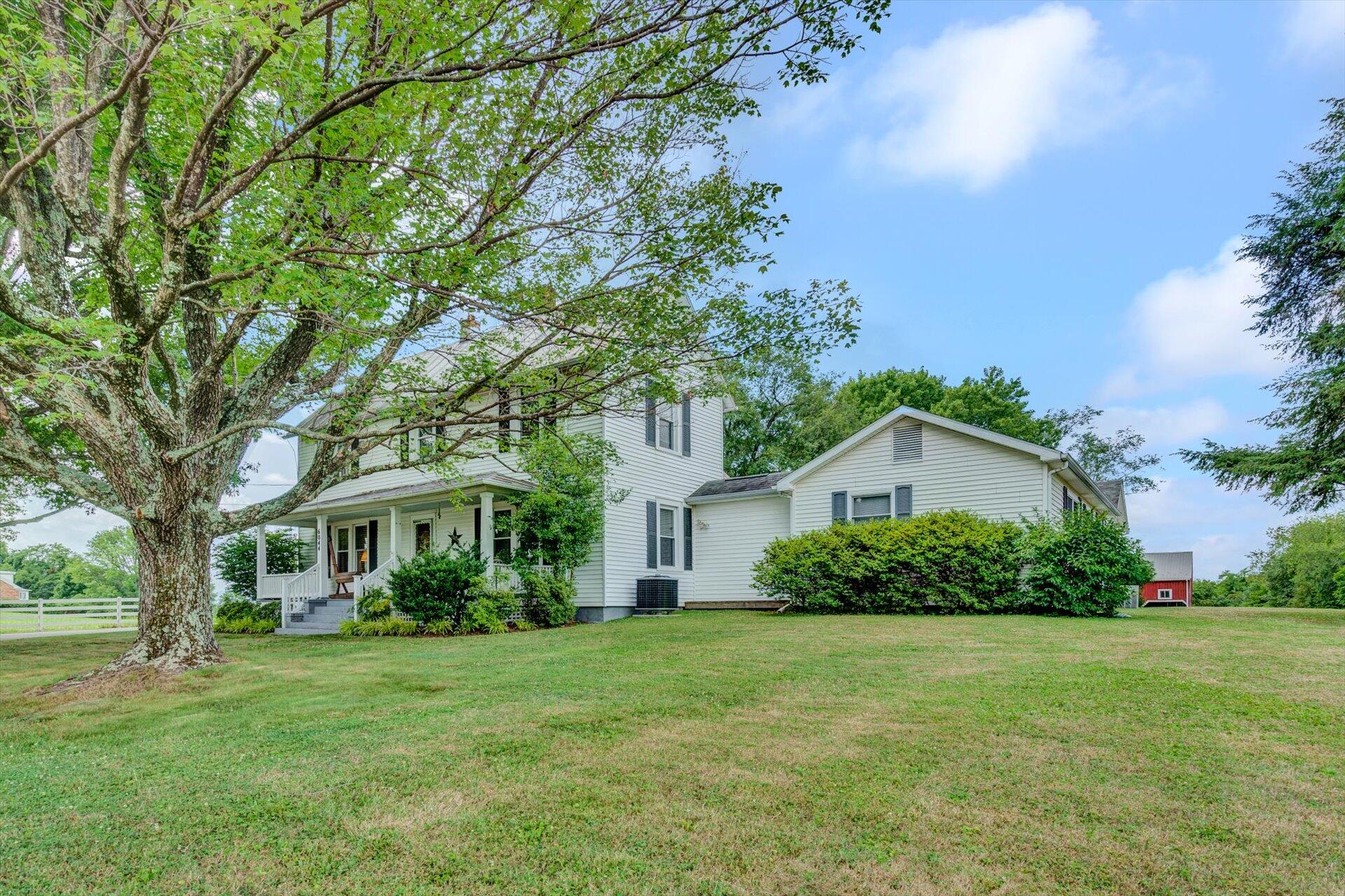 6044 Cove Road Roanoke, VA 24019 - Photo 2 of 67 a view of a house with a big yard and large trees