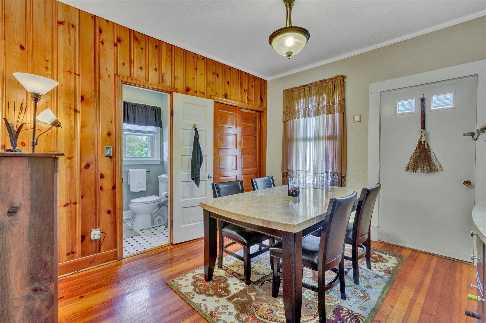 6044 Cove Road Roanoke, VA 24019 - Photo 12 of 67 a view of a dining room with furniture window and wooden floor