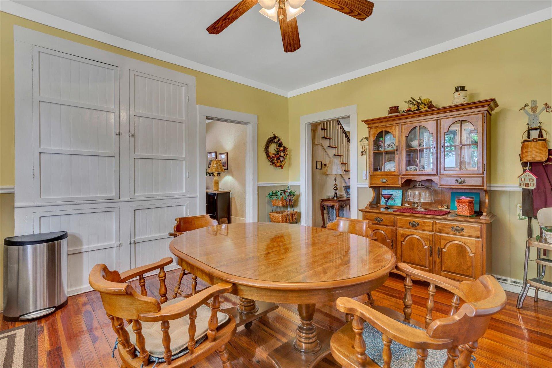 6044 Cove Road Roanoke, VA 24019 - Photo 17 of 67 a view of a dining room with furniture and a chandelier
