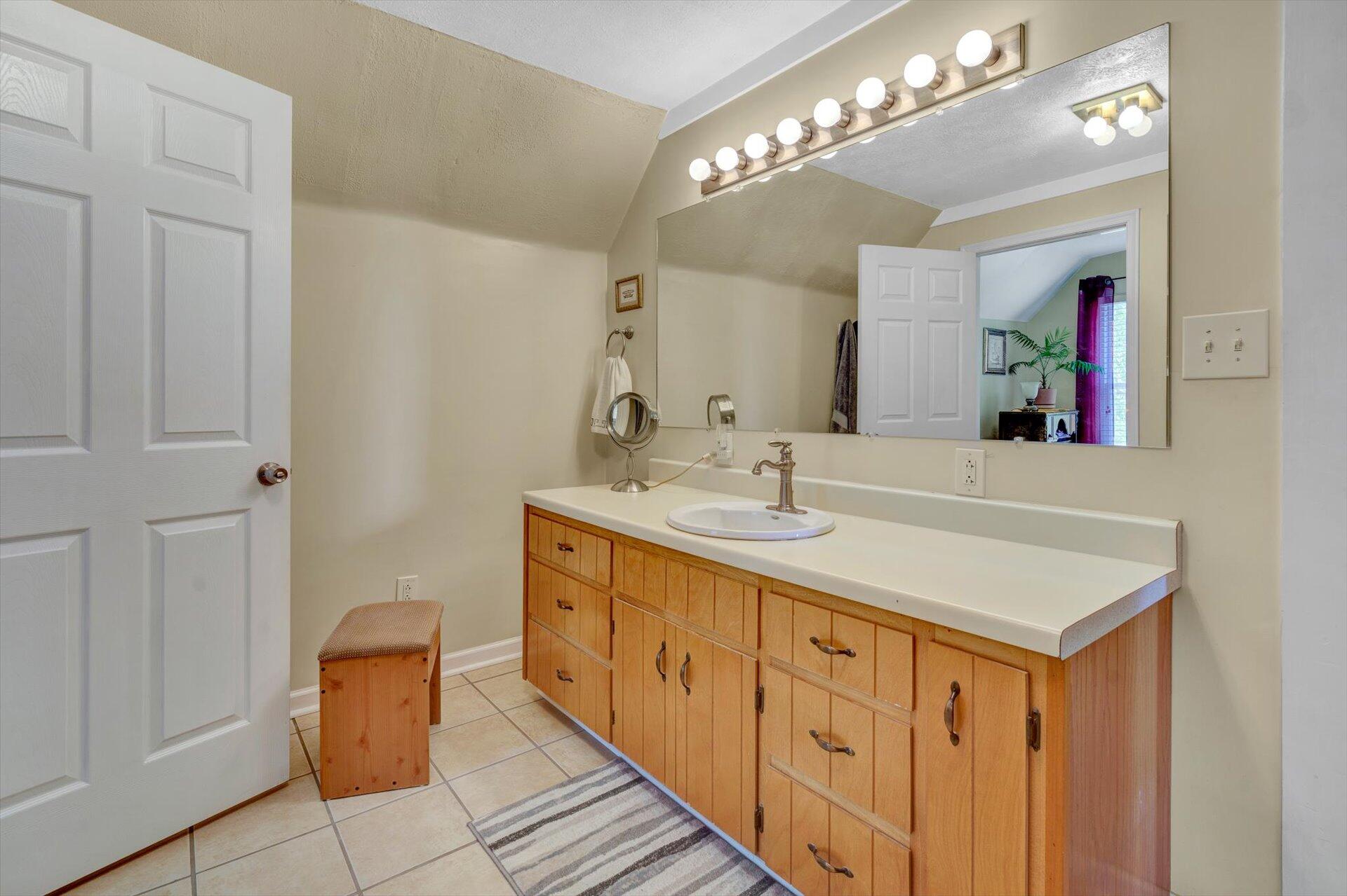 6044 Cove Road Roanoke, VA 24019 - Photo 22 of 67 a bathroom with a sink double vanity and a mirror