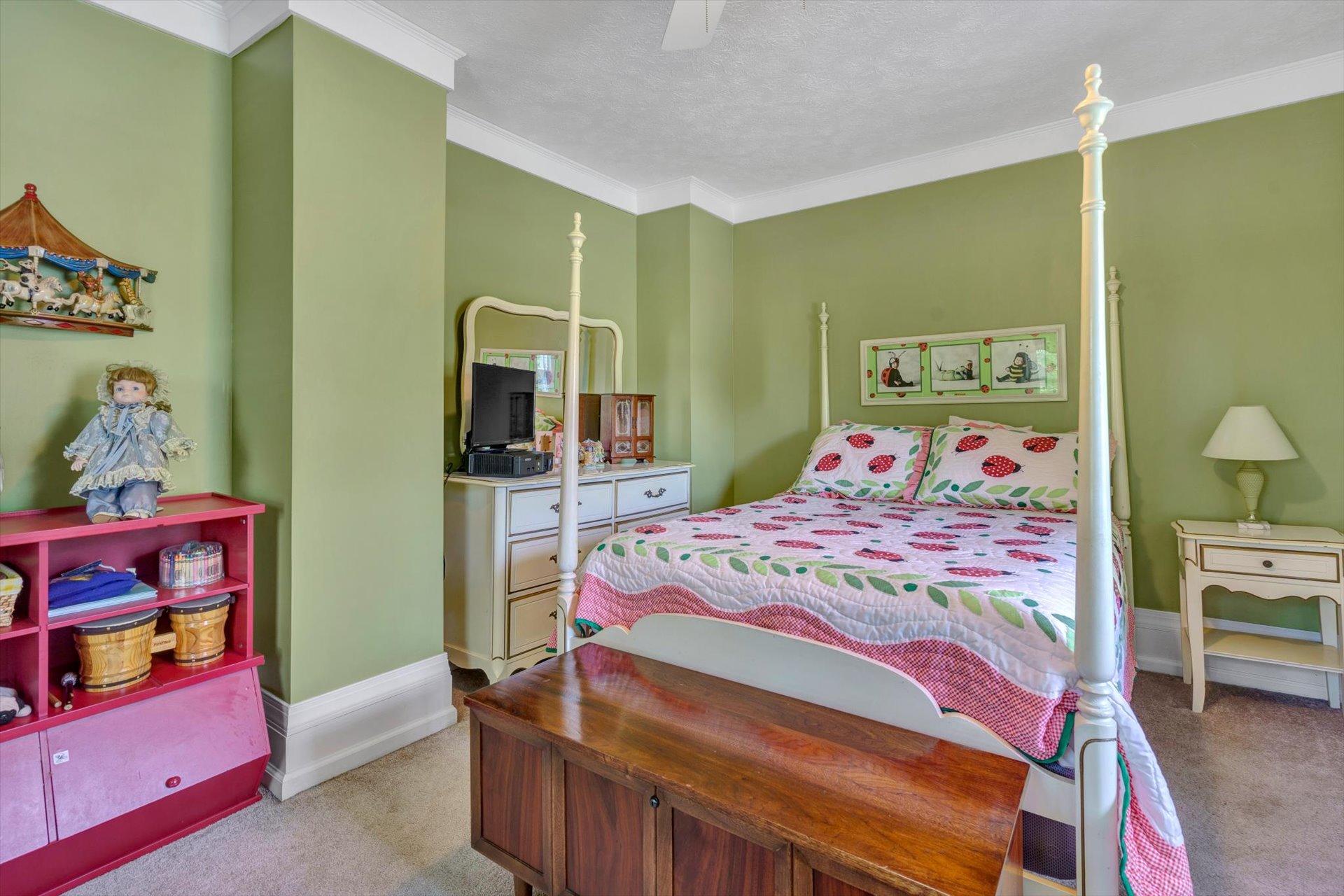 6044 Cove Road Roanoke, VA 24019 - Photo 25 of 67 a bedroom with a bed and large closet with mirror