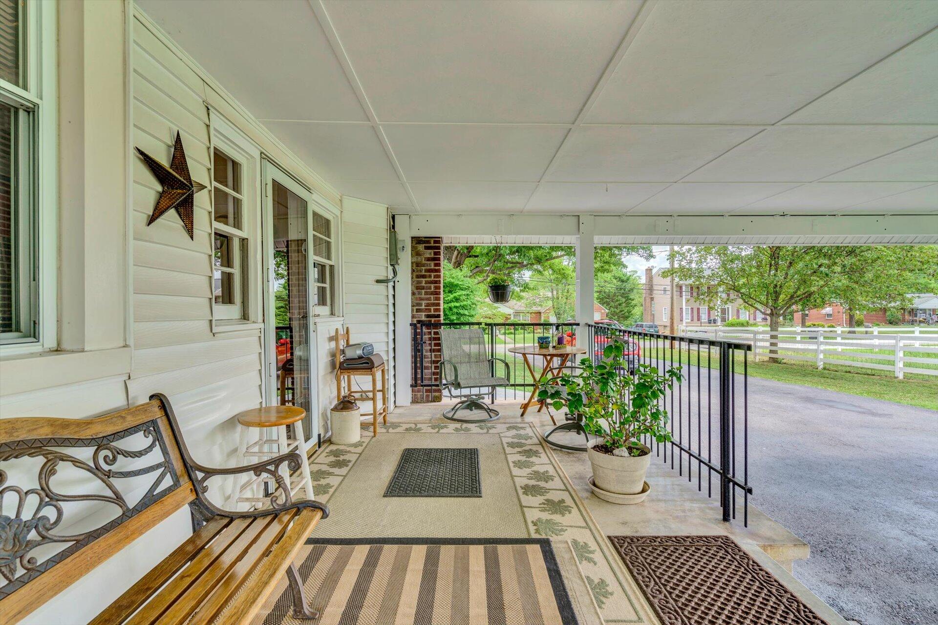 6044 Cove Road Roanoke, VA 24019 - Photo 29 of 67 a view of balcony with chairs and wooden floor