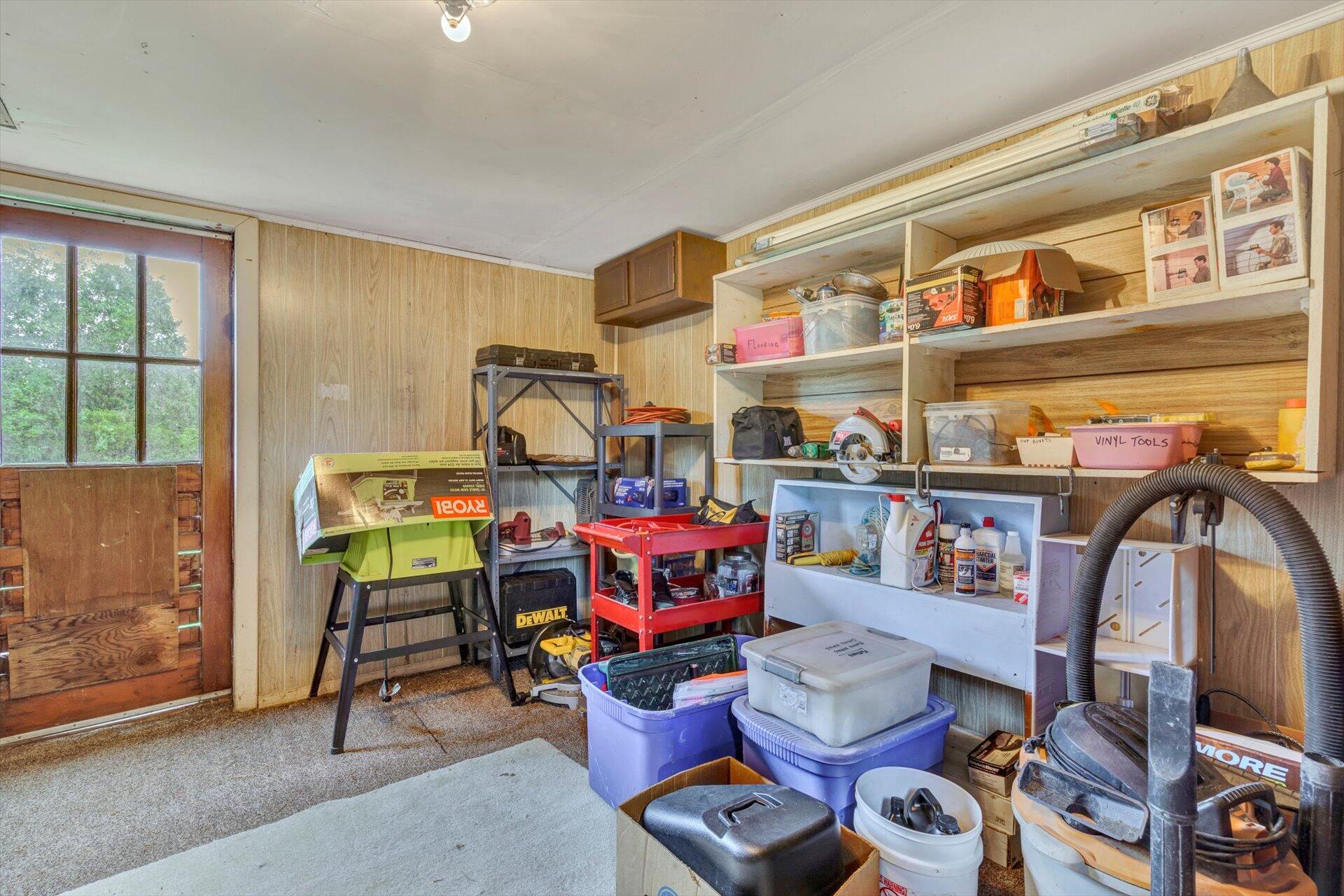 6044 Cove Road Roanoke, VA 24019 - Photo 45 of 67 a room with furniture and musical instruments