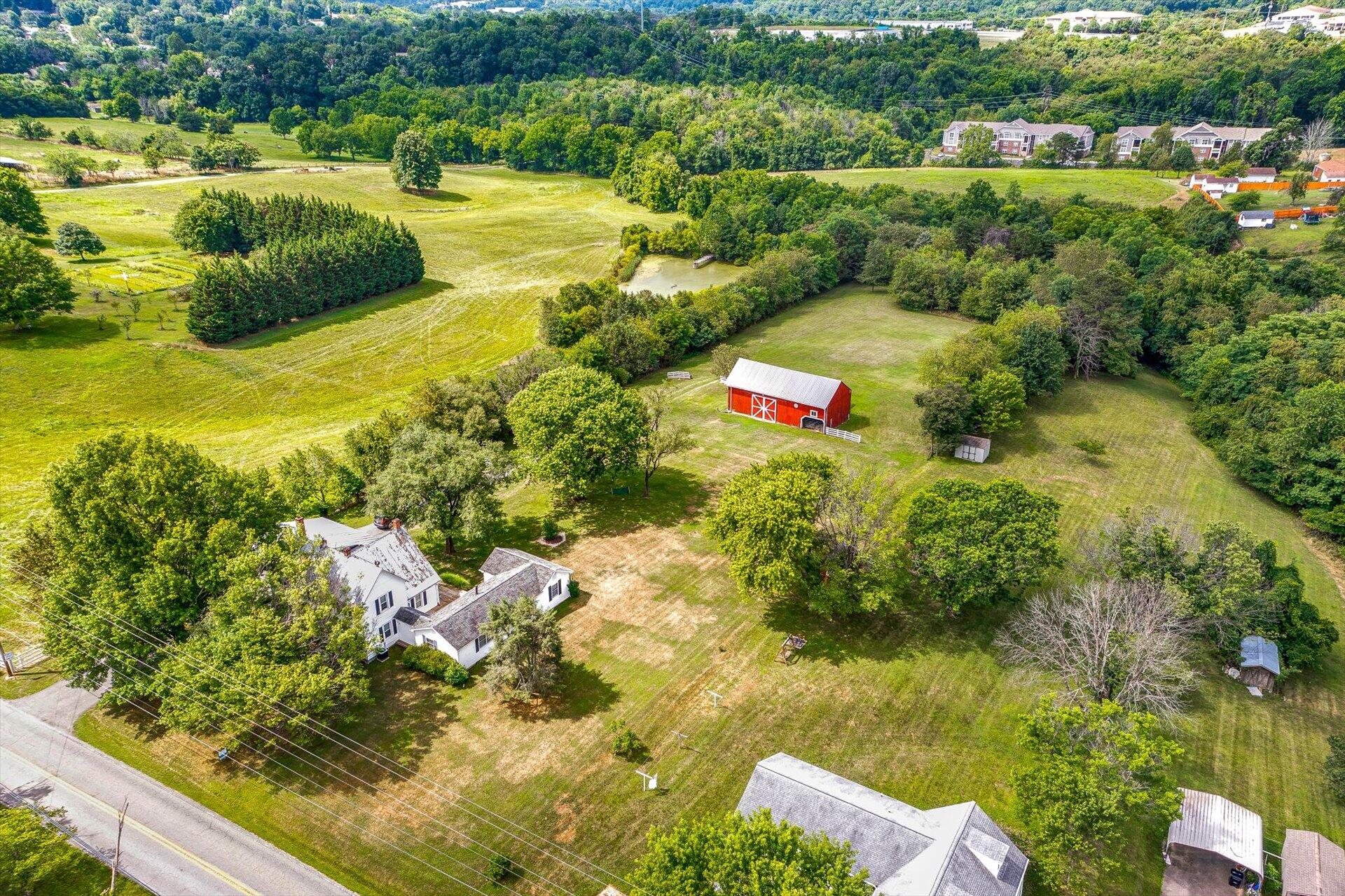 6044 Cove Road Roanoke, VA 24019 - Photo 58 of 67 a view of a lake with a house