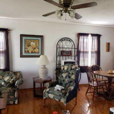 6044 Cove Road Roanoke, VA 24019 - Photo 64 of 67 a living room with furniture chess table and a large window