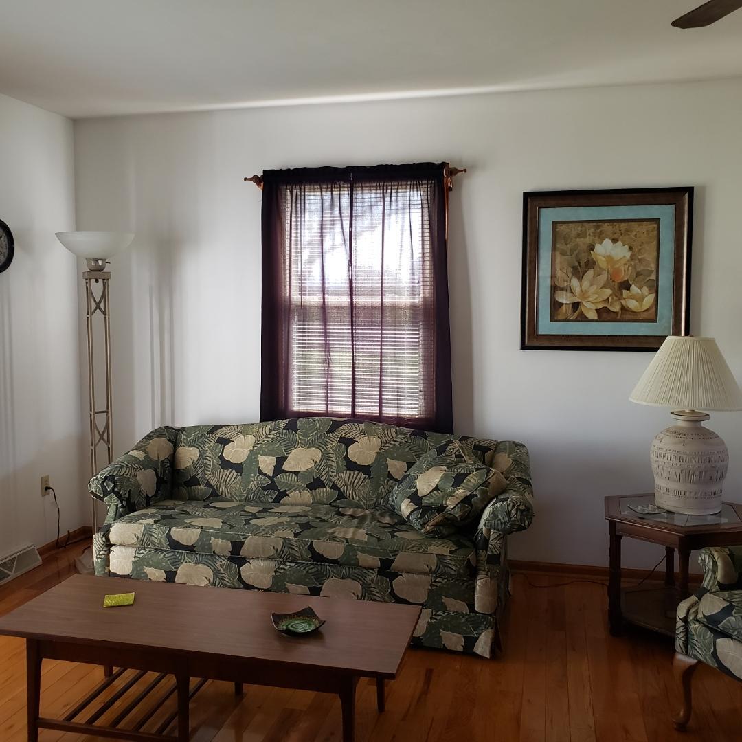 6044 Cove Road Roanoke, VA 24019 - Photo 65 of 67 a bed sitting in a bedroom next to a window