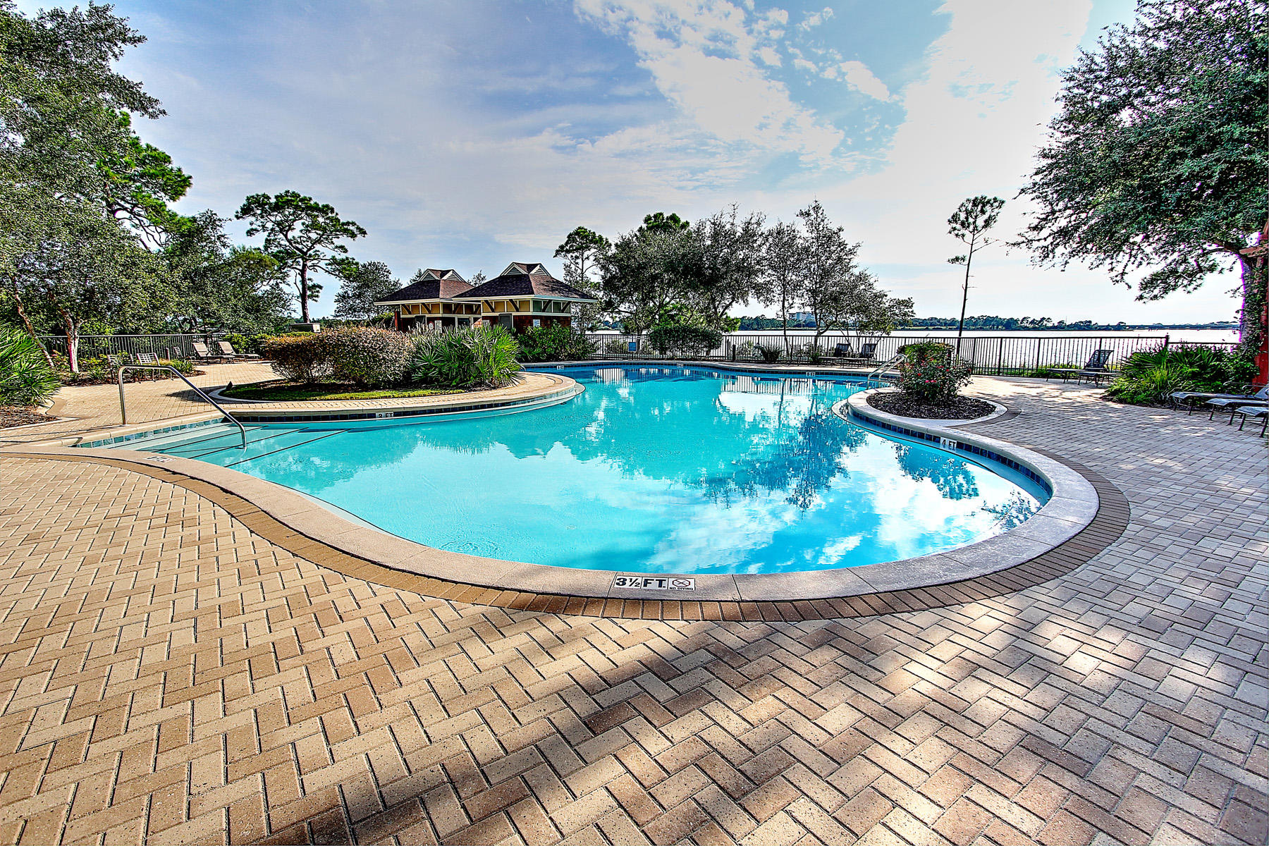 1101 Prospect Promenade, Unit 401 Panama City Beach, FL 32413 - Photo 22 of 35 a view of a swimming pool with outdoor seating