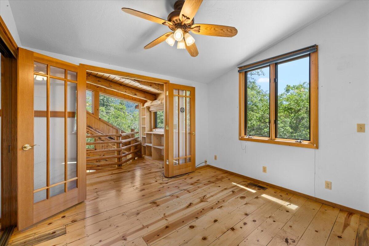 7388 Upper Applegate Road Jacksonville, OR 97530 - Photo 19 of 57 Upstairs bedroom or office with French doors leading to private reading nook