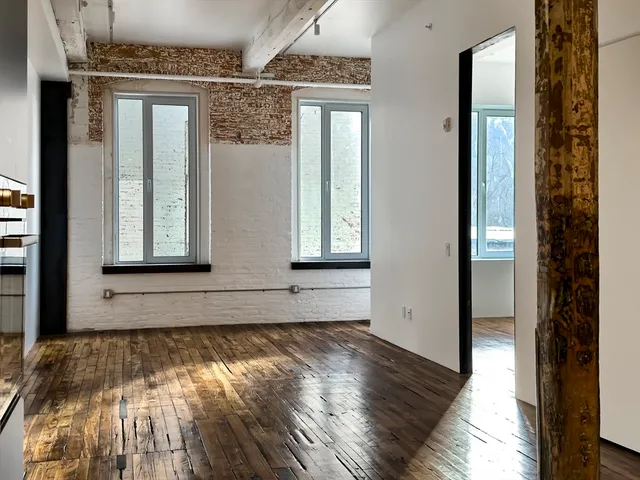 a view of front door with wooden floor