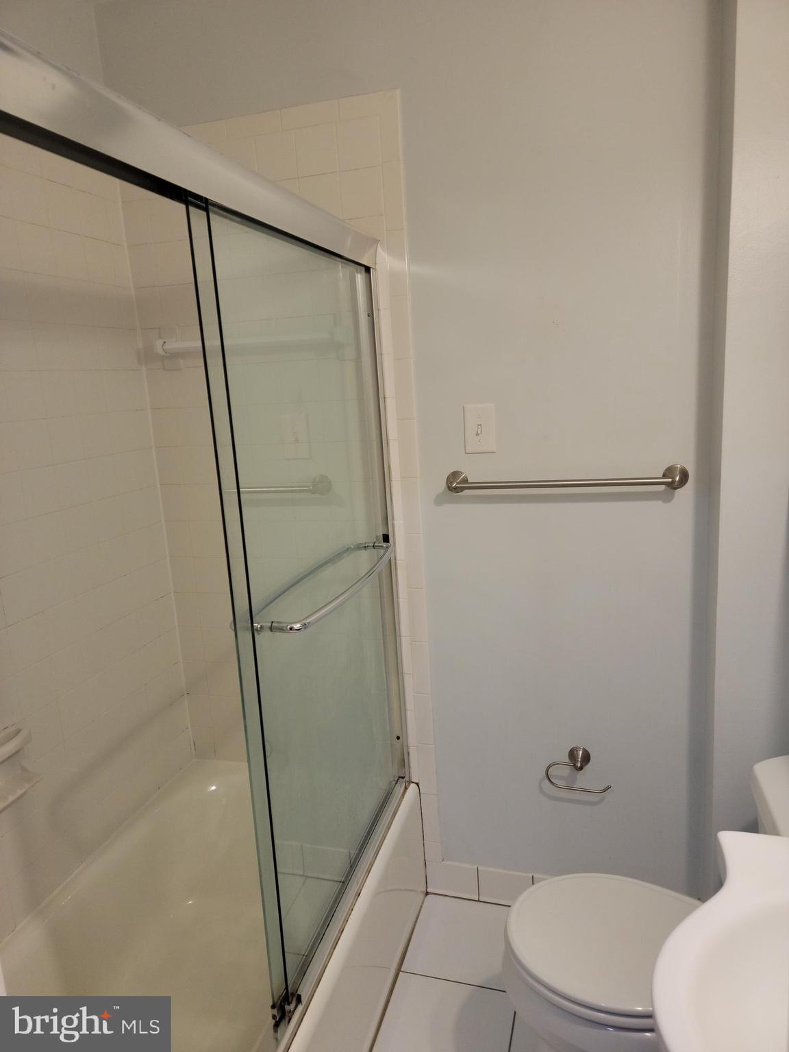 133 North Payne Street, Unit 2 Alexandria, VA 22314 - Photo 5 of 16 a bathroom with a shower and a toilet
