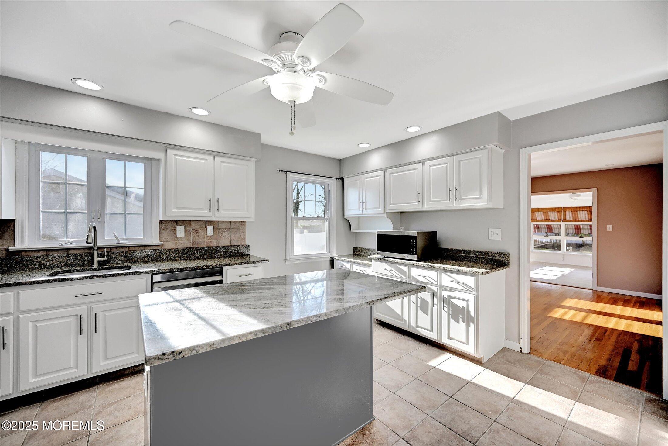 539 Summit Drive Point Pleasant, NJ 08742 - Photo 14 of 33 a kitchen with stainless steel appliances a stove sink and cabinets