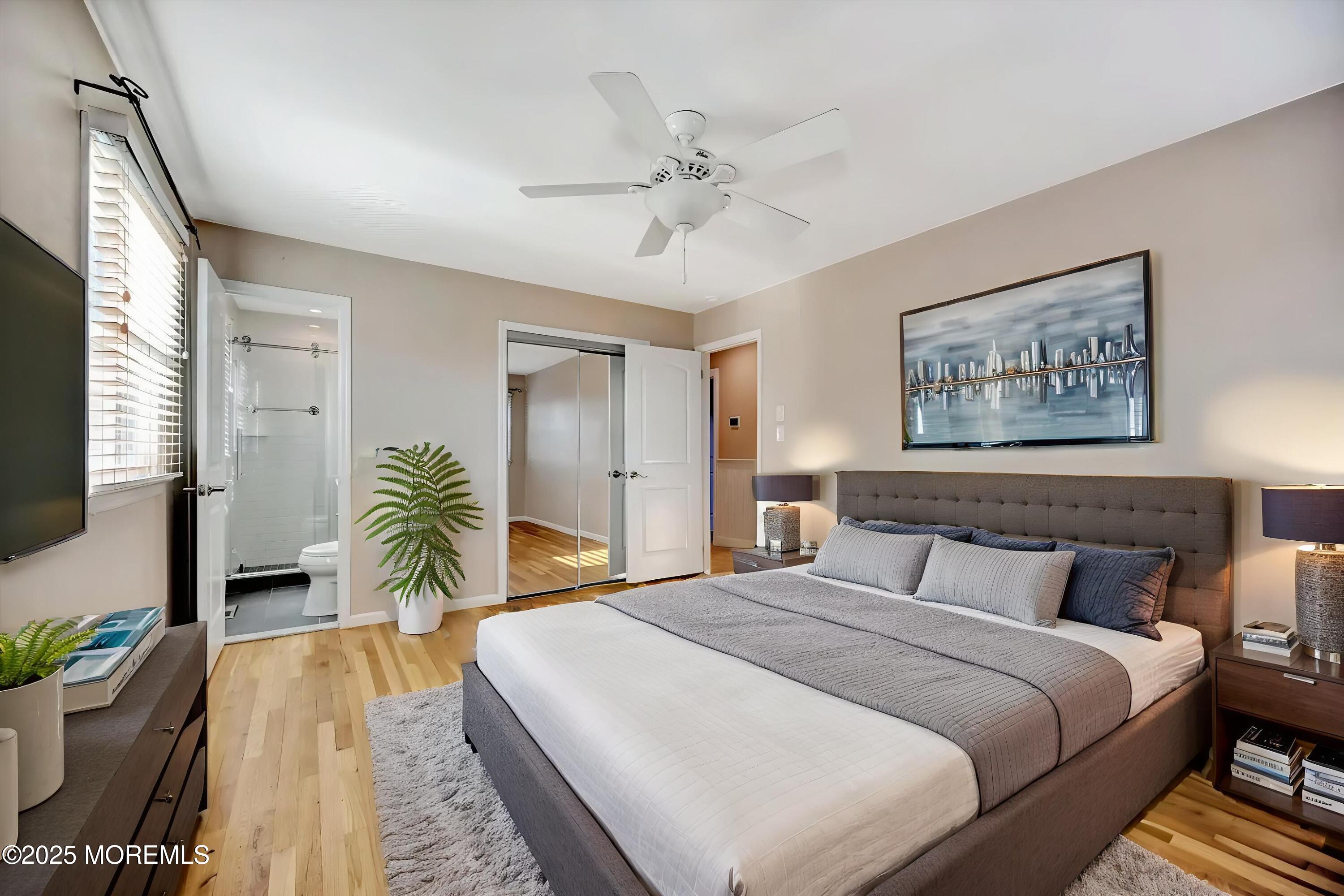 539 Summit Drive Point Pleasant, NJ 08742 - Photo 17 of 33 a bedroom with a bed and a chandelier