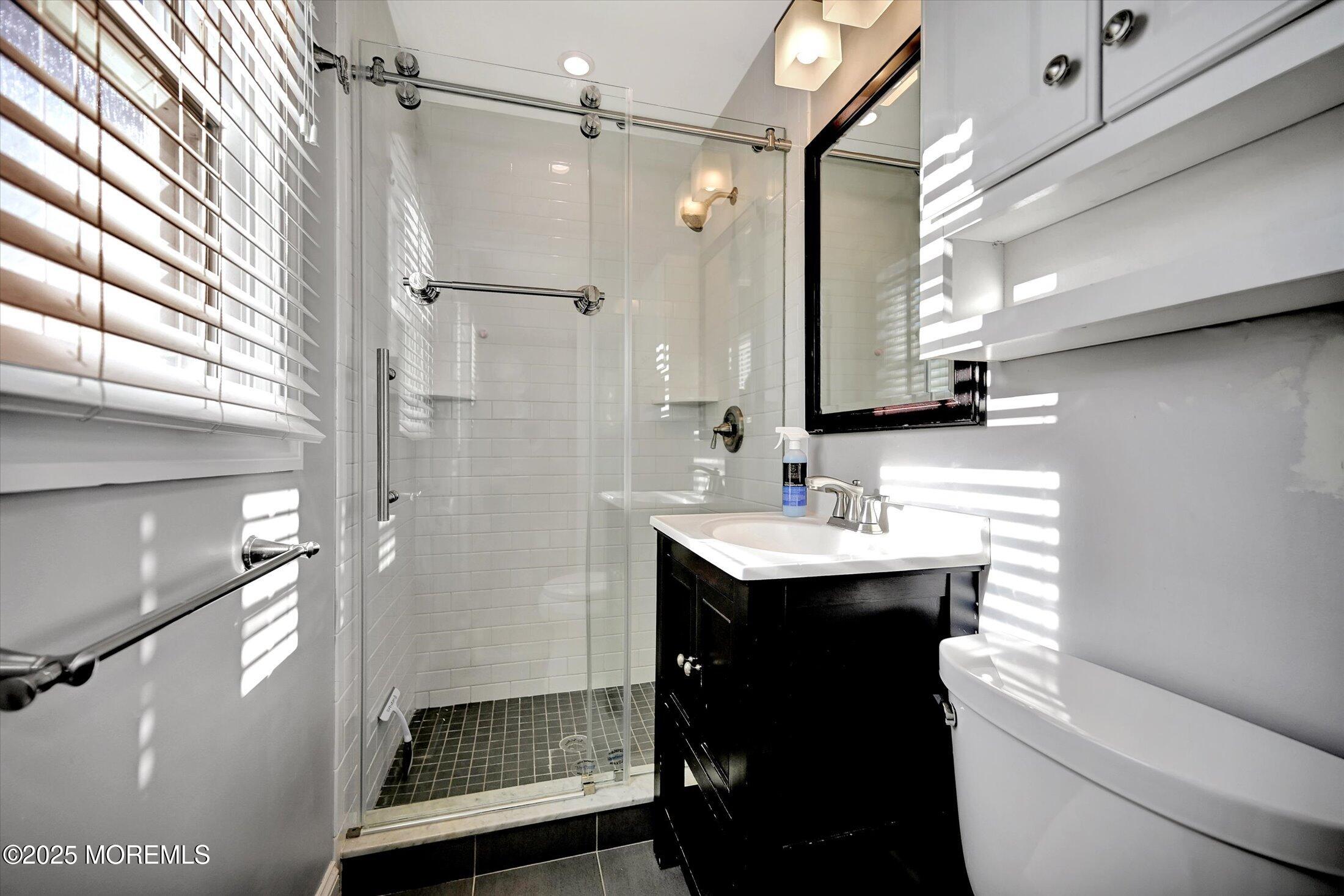 539 Summit Drive Point Pleasant, NJ 08742 - Photo 19 of 33 a bathroom with a sink a toilet and shower