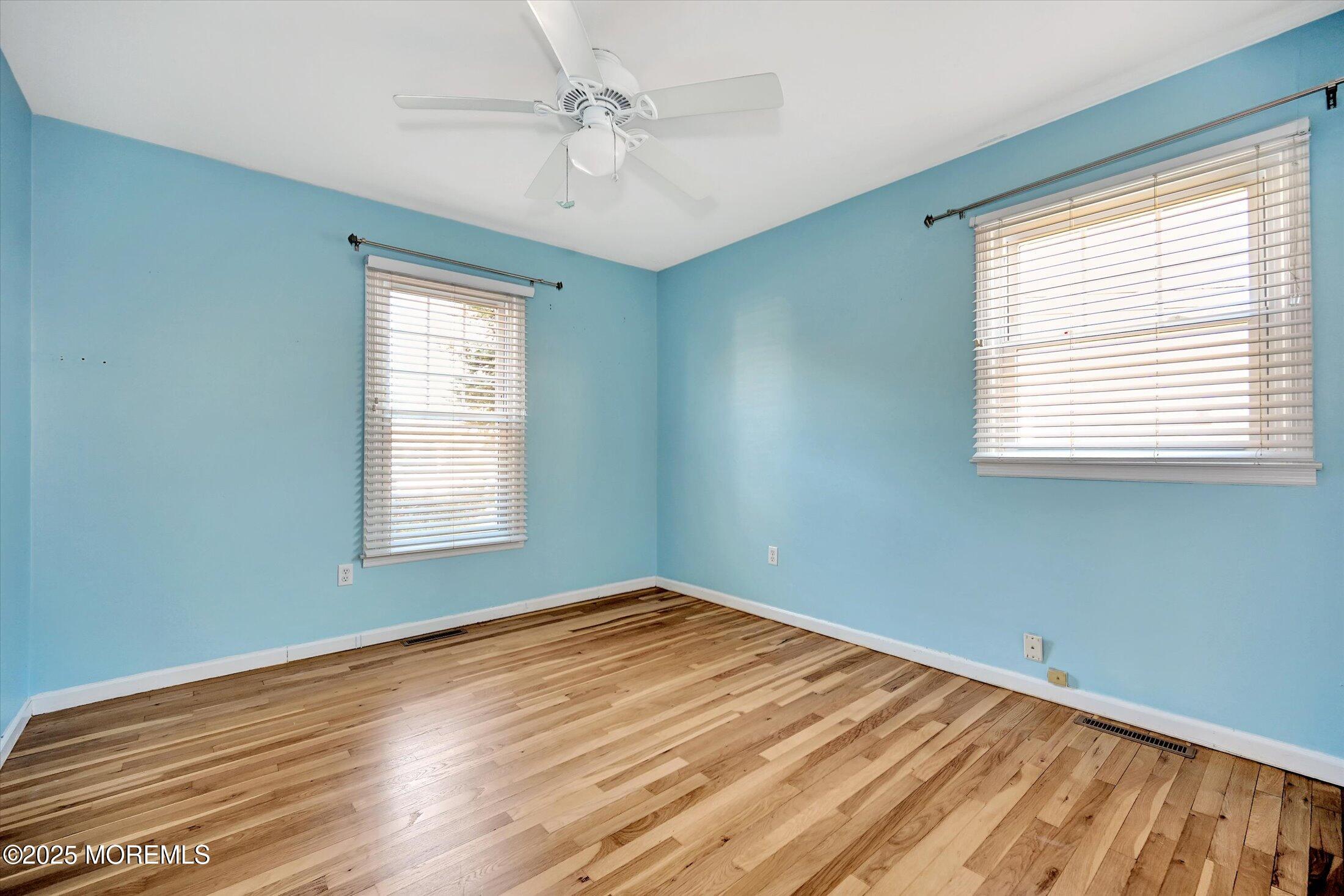 539 Summit Drive Point Pleasant, NJ 08742 - Photo 20 of 33 a view of empty room with wooden floor and fan