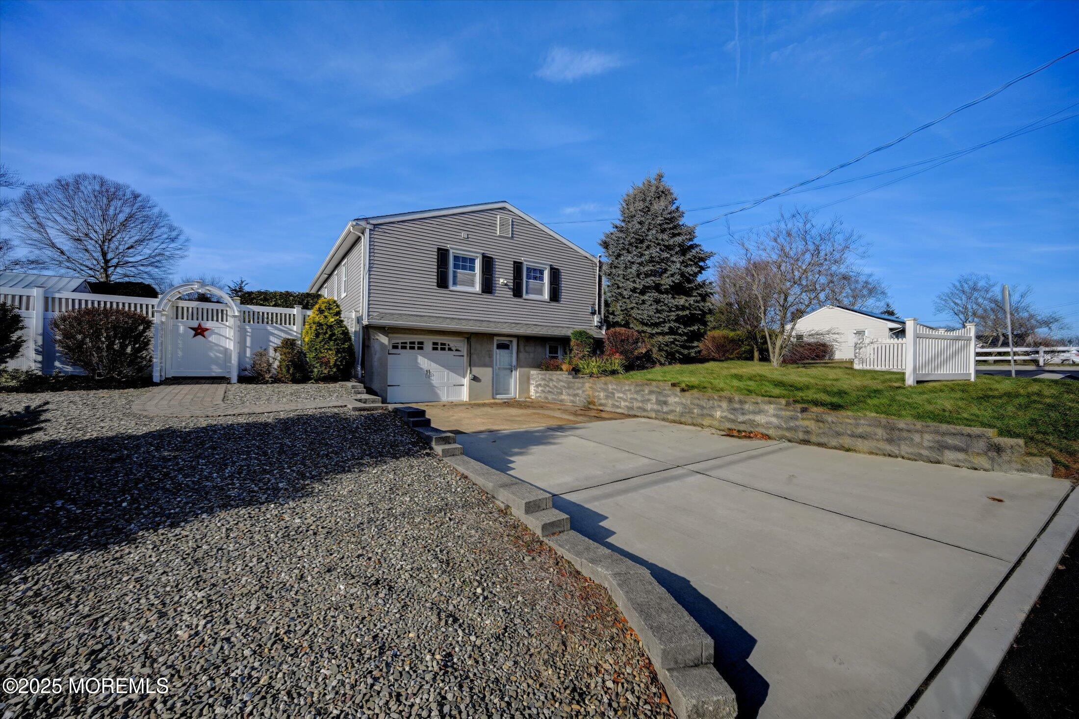 539 Summit Drive Point Pleasant, NJ 08742 - Photo 27 of 33 a front view of a house with a yard