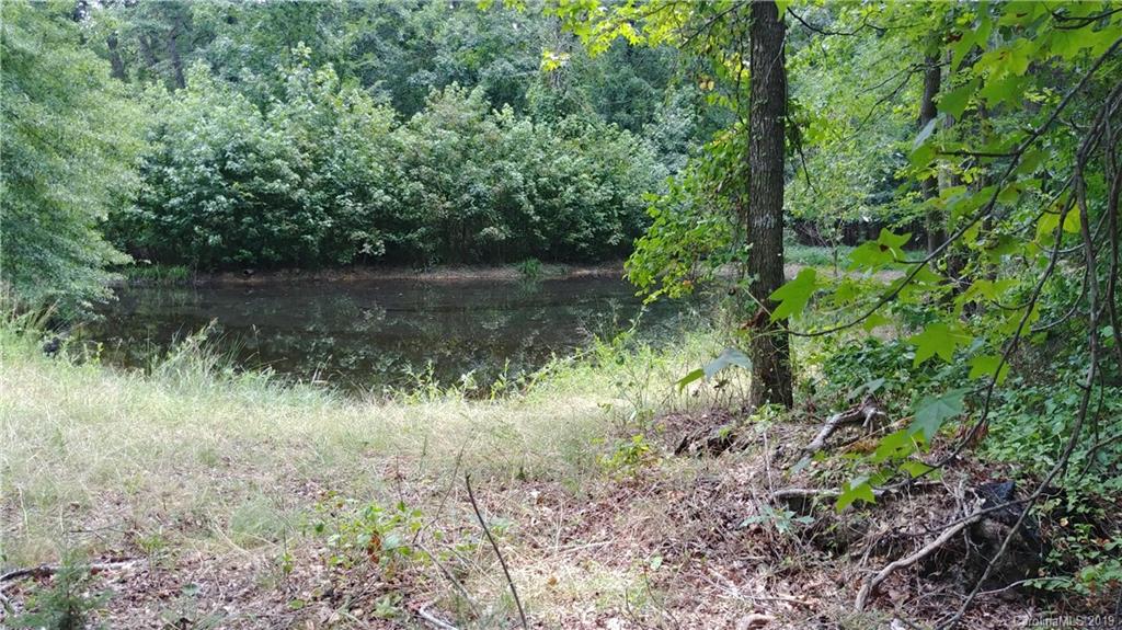 4807 Belk Mill Road Monroe, NC 28112 - Photo 2 of 2 a view of a lake with a forest