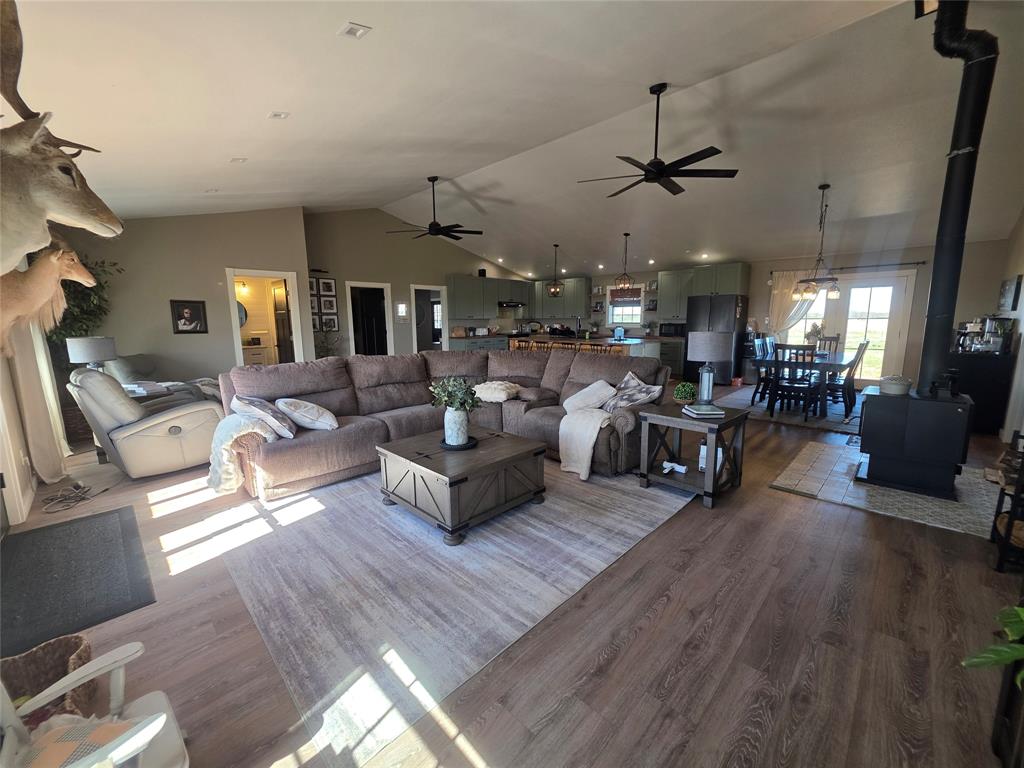 1225 R R G Loop Olney, TX 76374 - Photo 11 of 40 a living room with furniture kitchen view and a wooden floor