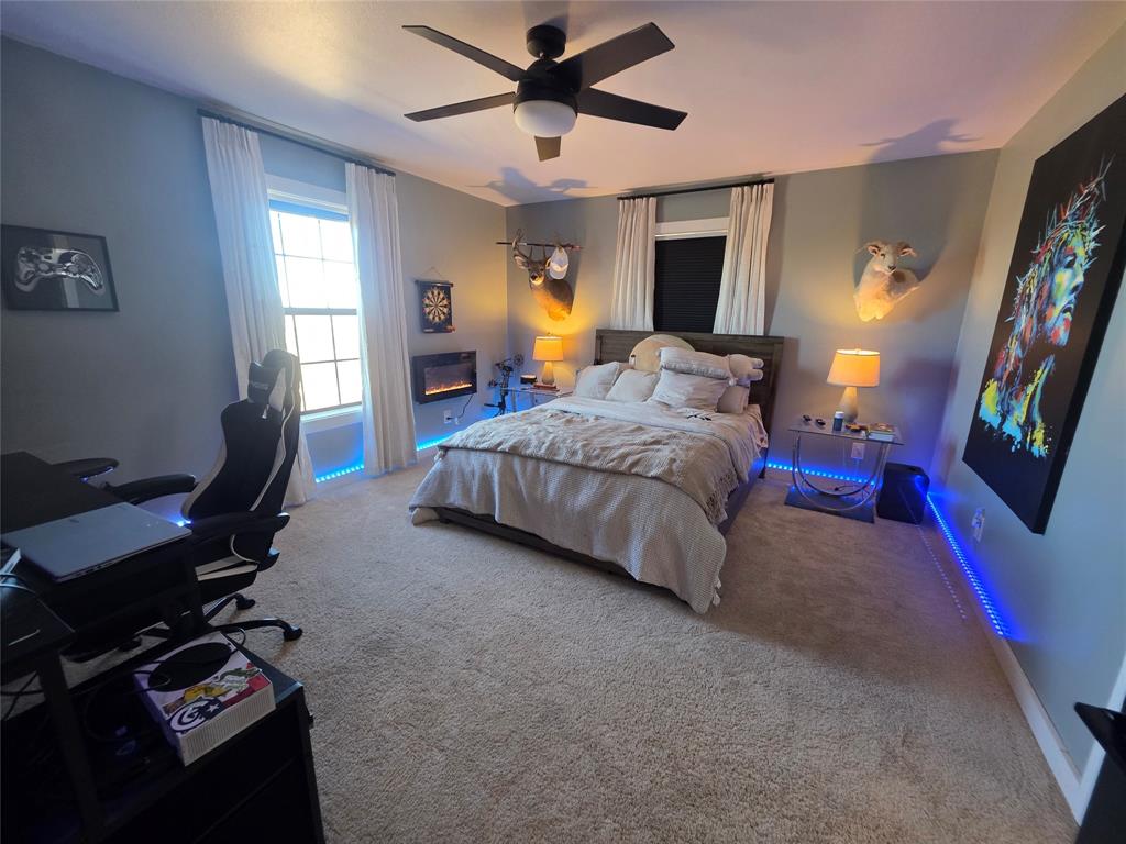 1225 R R G Loop Olney, TX 76374 - Photo 14 of 40 a bedroom with a bed gym equipment and a window