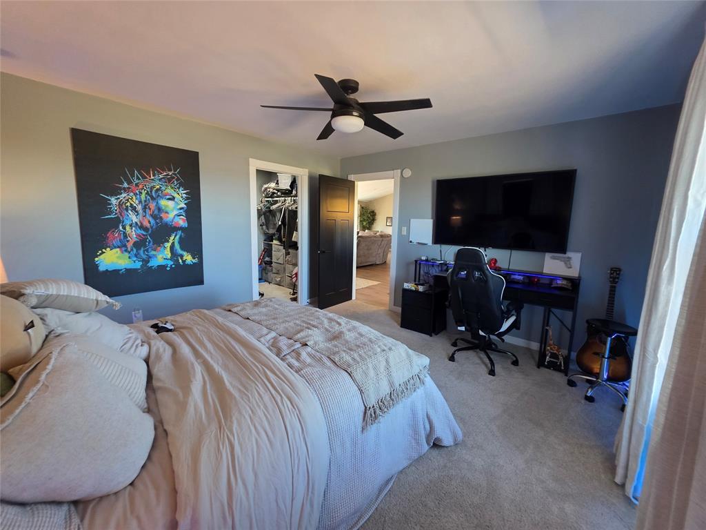 1225 R R G Loop Olney, TX 76374 - Photo 15 of 40 a bed room with a bed and a television