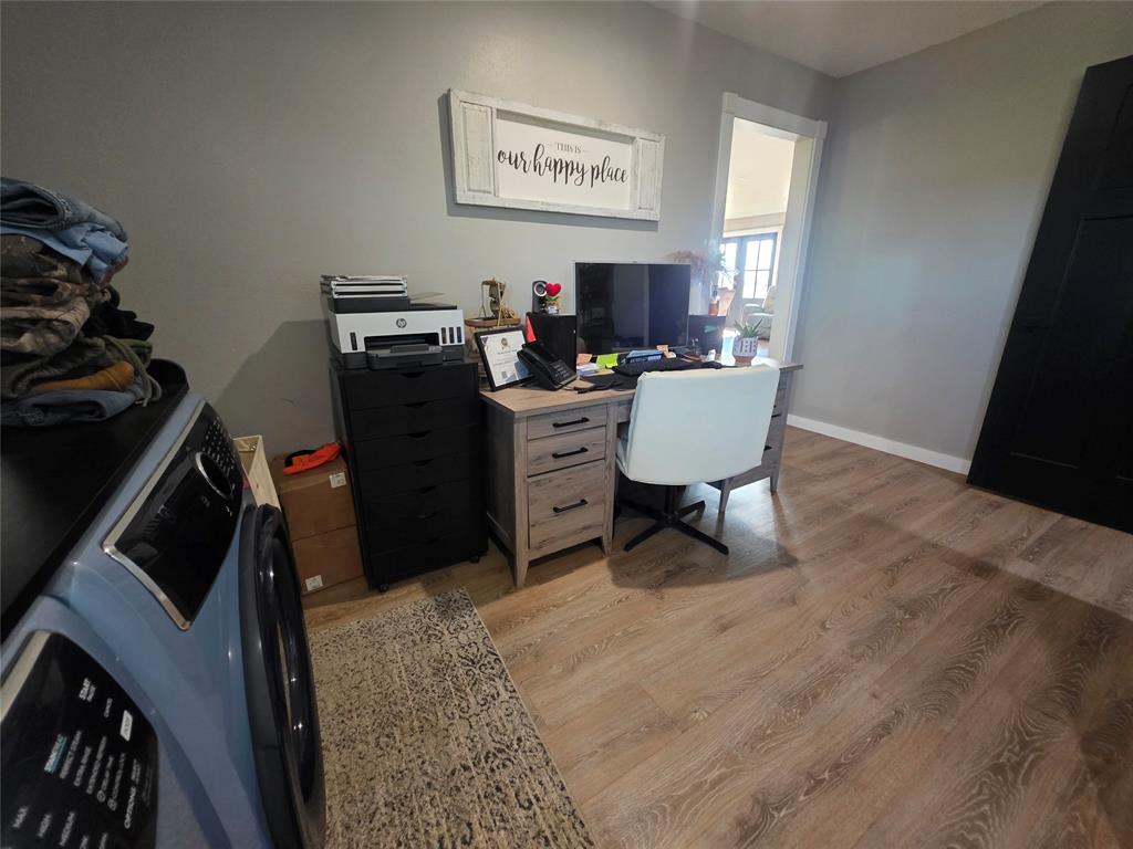 1225 R R G Loop Olney, TX 76374 - Photo 21 of 40 a view of a workspace with furniture and a window