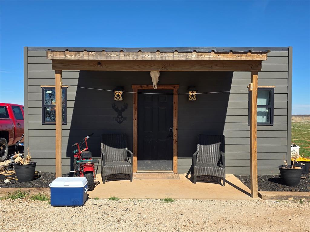 1225 R R G Loop Olney, TX 76374 - Photo 37 of 40 a view of a chairs and table in the back yard