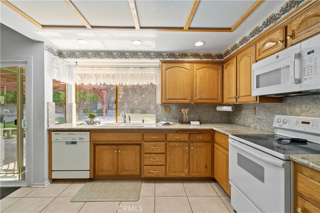 28784 Eagleton Street Agoura Hills, CA 91301 - Photo 18 of 48 a kitchen with a sink and cabinets