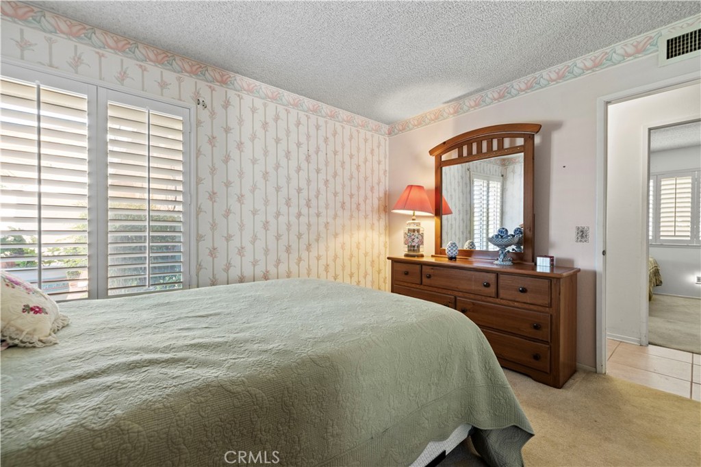 28784 Eagleton Street Agoura Hills, CA 91301 - Photo 21 of 48 a bedroom with a bed and a dresser