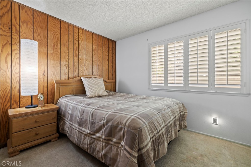 28784 Eagleton Street Agoura Hills, CA 91301 - Photo 23 of 48 a bedroom with a bed and large window