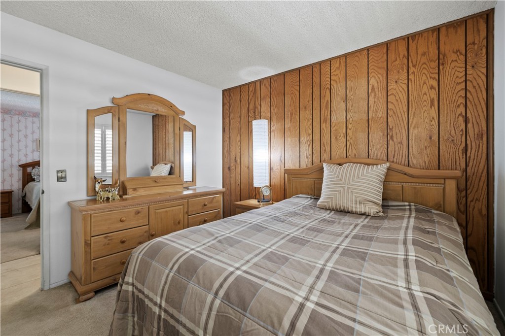 28784 Eagleton Street Agoura Hills, CA 91301 - Photo 25 of 48 a bedroom with a large bed and a closet