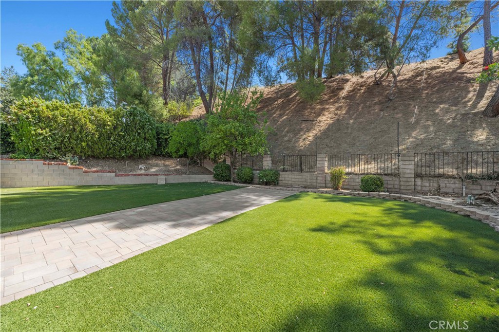 28784 Eagleton Street Agoura Hills, CA 91301 - Photo 37 of 48 a swimming pool with outdoor seating and yard