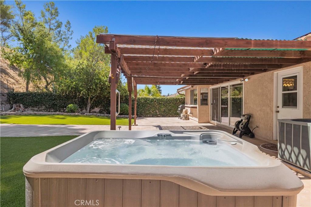 28784 Eagleton Street Agoura Hills, CA 91301 - Photo 40 of 48 a view of a house with swimming pool and porch
