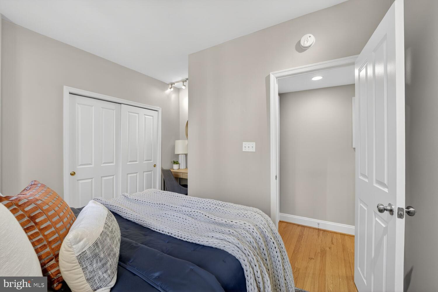 1701 16th Street Northwest, Unit 440 Washington, DC 20009 - Photo 18 of 31 a bedroom with a bed and a mirror