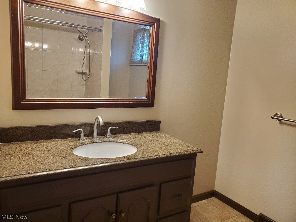 12221 Reno Drive Parma, OH 44130 - Photo 25 of 29 Bathroom with tile flooring and large vanity