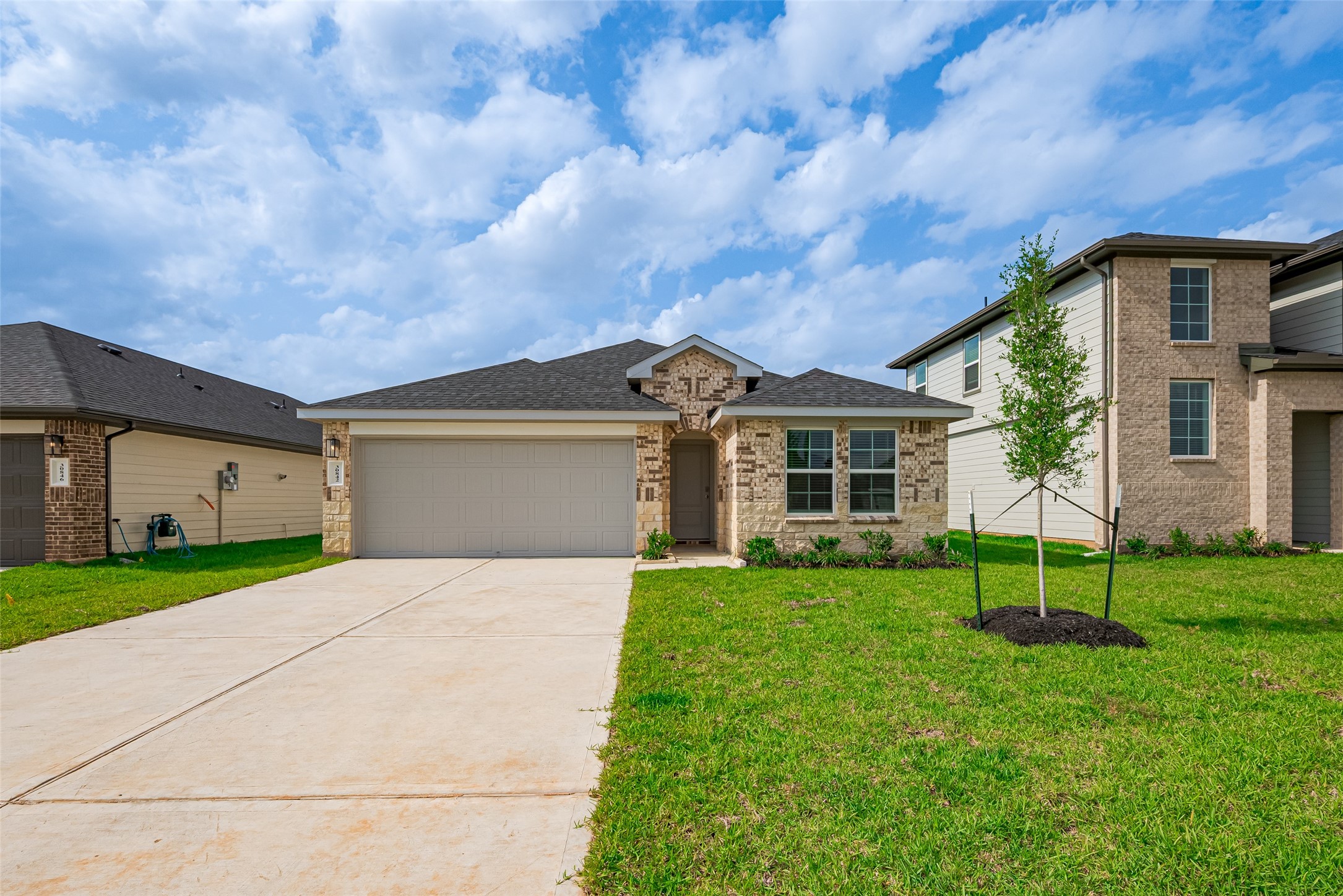 30842 Brightwell Bend Fulshear, TX 77441 - Photo 5 of 31 Charming brick and stone elevation with great curb appeal! This single-story home features a two-car garage, covered entryway, and fresh landscaping on a spacious lot