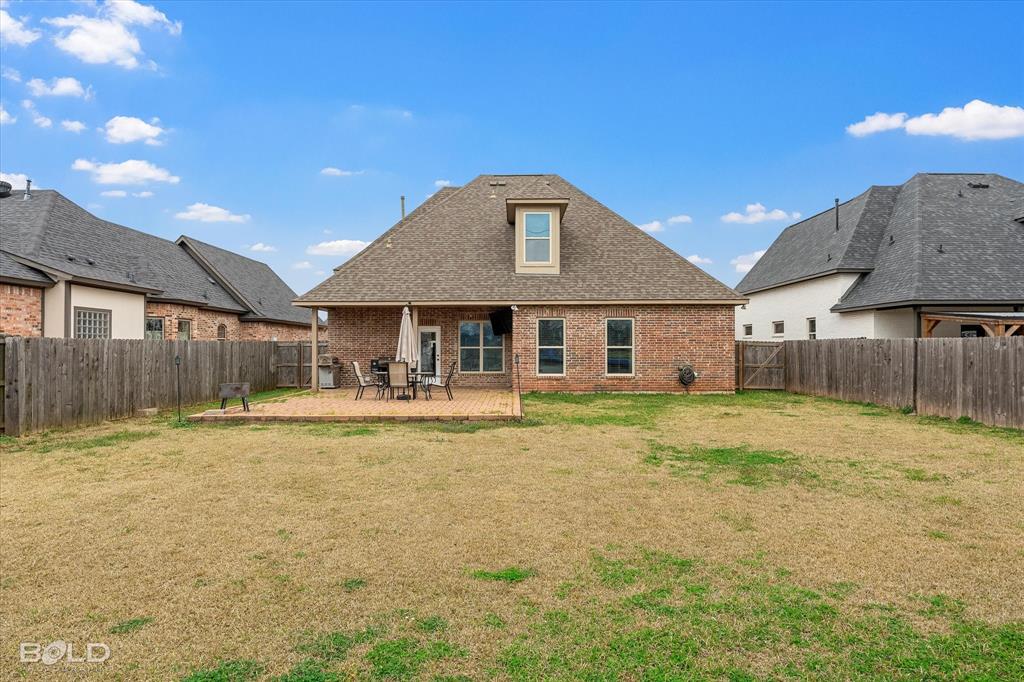 946 Maize Street Bossier City, LA 71111 - Photo 6 of 39 a front view of a house with a garden and patio