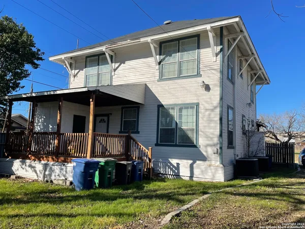 a view of house with yard