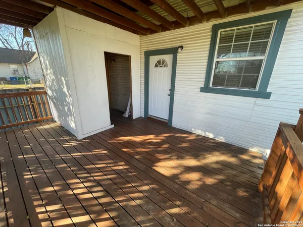 a view of backyard with porch