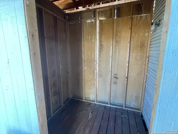 a view of a bathroom with wooden floor