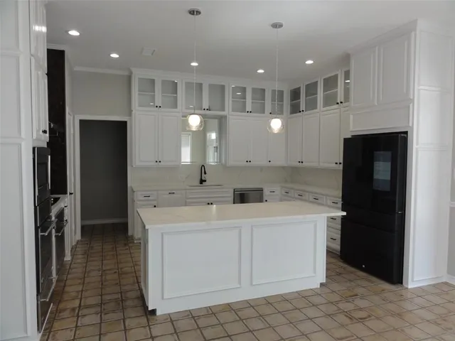 a kitchen with a cabinets and a stove