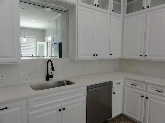 a kitchen with a stove and a refrigerator