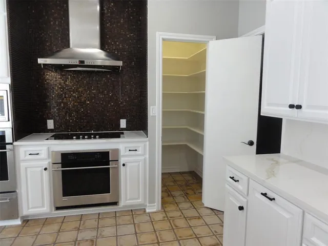 a bedroom with a bed window and wooden floor