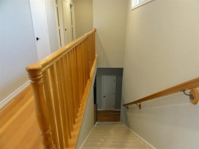 a living room with furniture and a ceiling fan