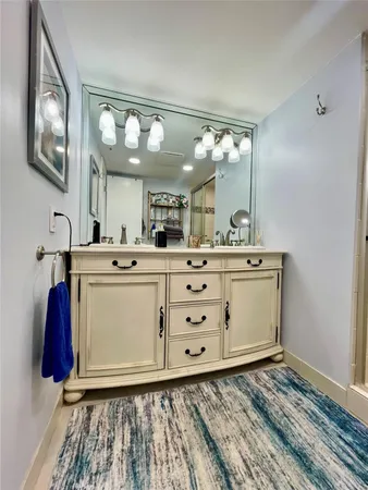 a bathroom with a toilet a sink and shower