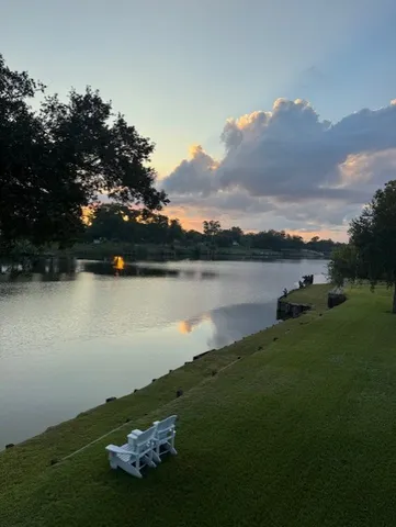 a view of a lake with houses in the back
