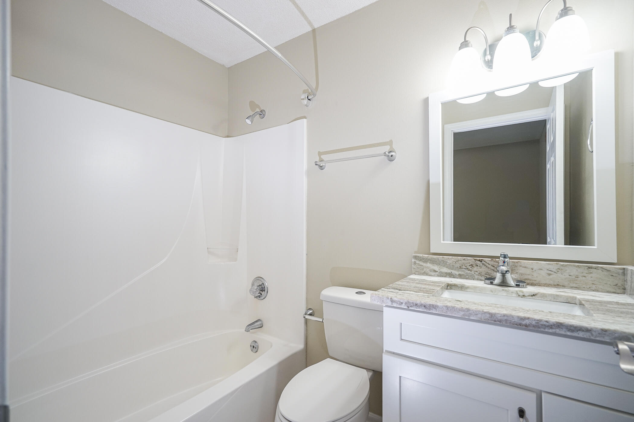 16 Court Drive Destin, FL 32541 - Photo 20 of 50 a bathroom with a granite countertop sink toilet and shower