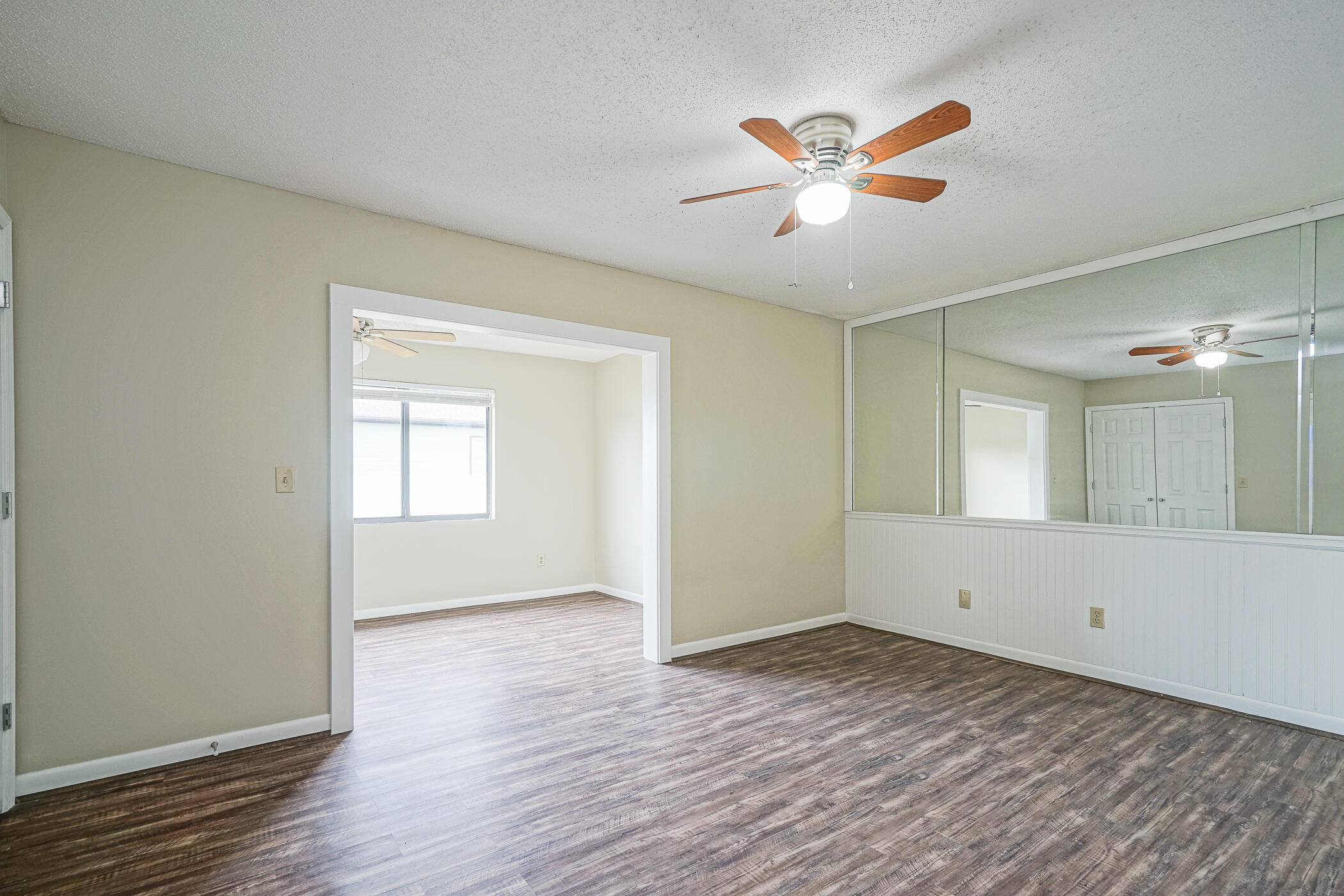 16 Court Drive Destin, FL 32541 - Photo 21 of 50 a view of an empty room with window and wooden floor