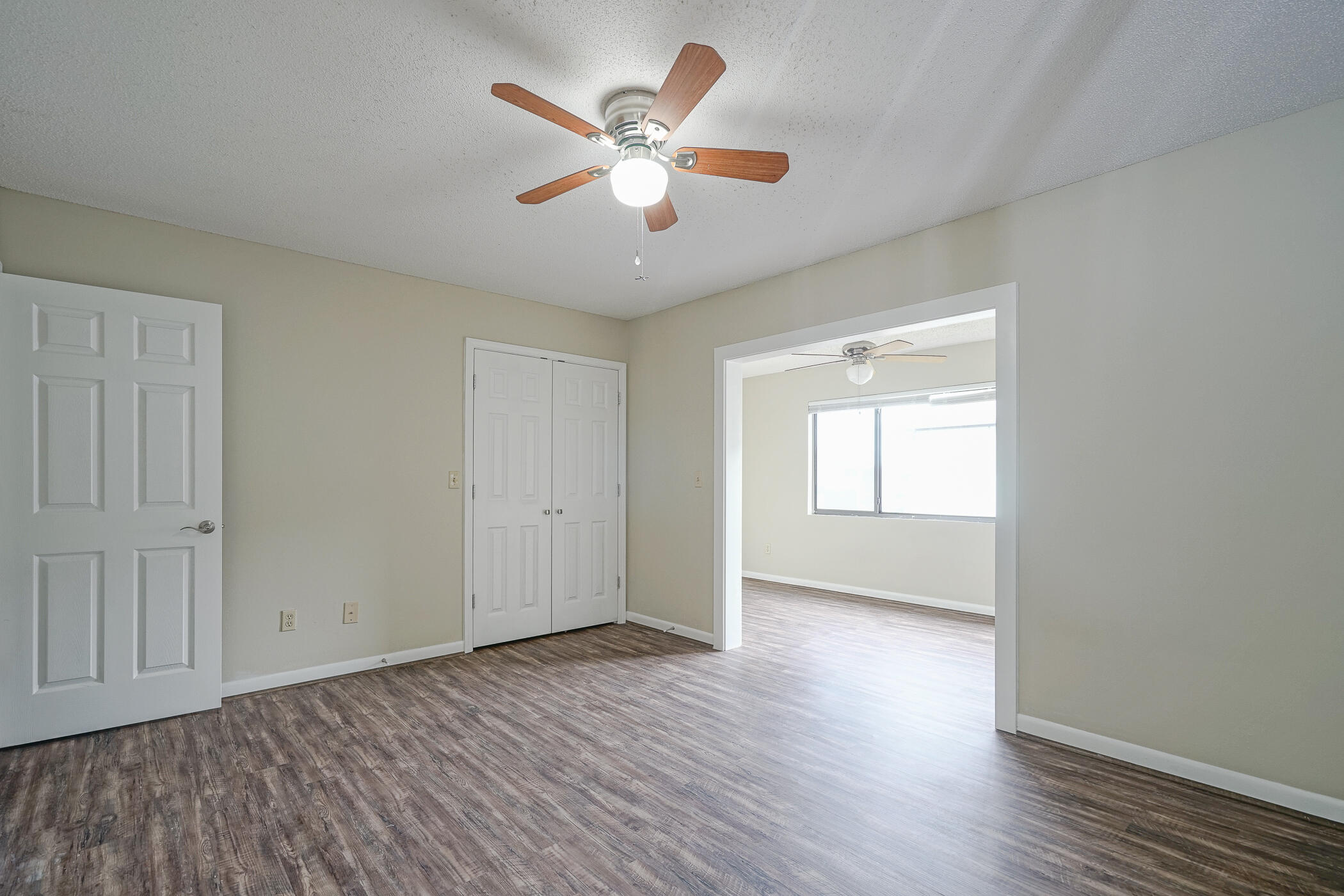 16 Court Drive Destin, FL 32541 - Photo 24 of 50 an empty room with wooden floor and windows